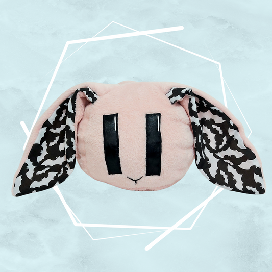 Pale pink bunny plushie with bats