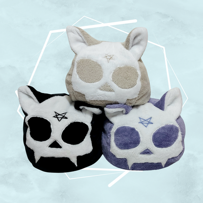 Cat skull designed quirky style plushies with pentagram and various colors, handmade by female indie artist in the UK