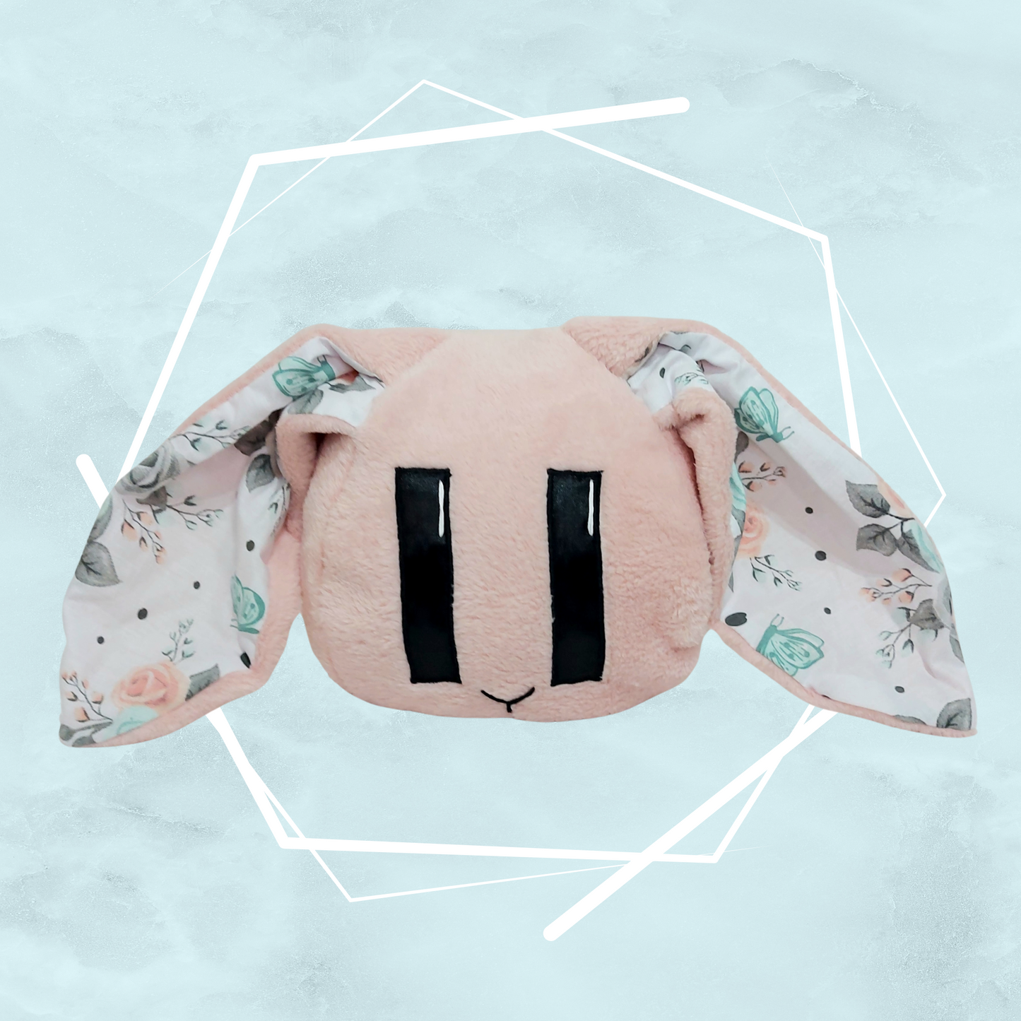 Pale pink floral, hand made stuffed toy in the shape of a bunny with long ears, kawaii japanese design by a UK-based artist