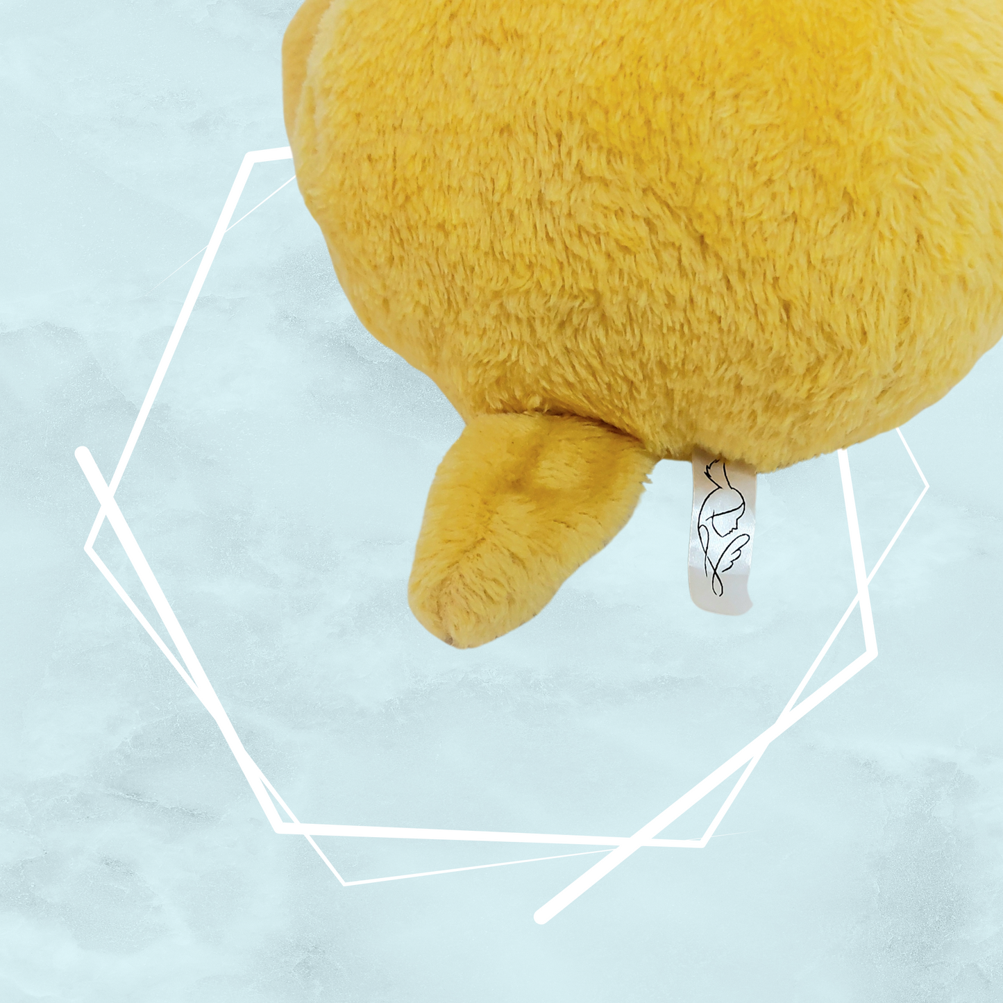 Small yellow bunny plushie with colorful planets