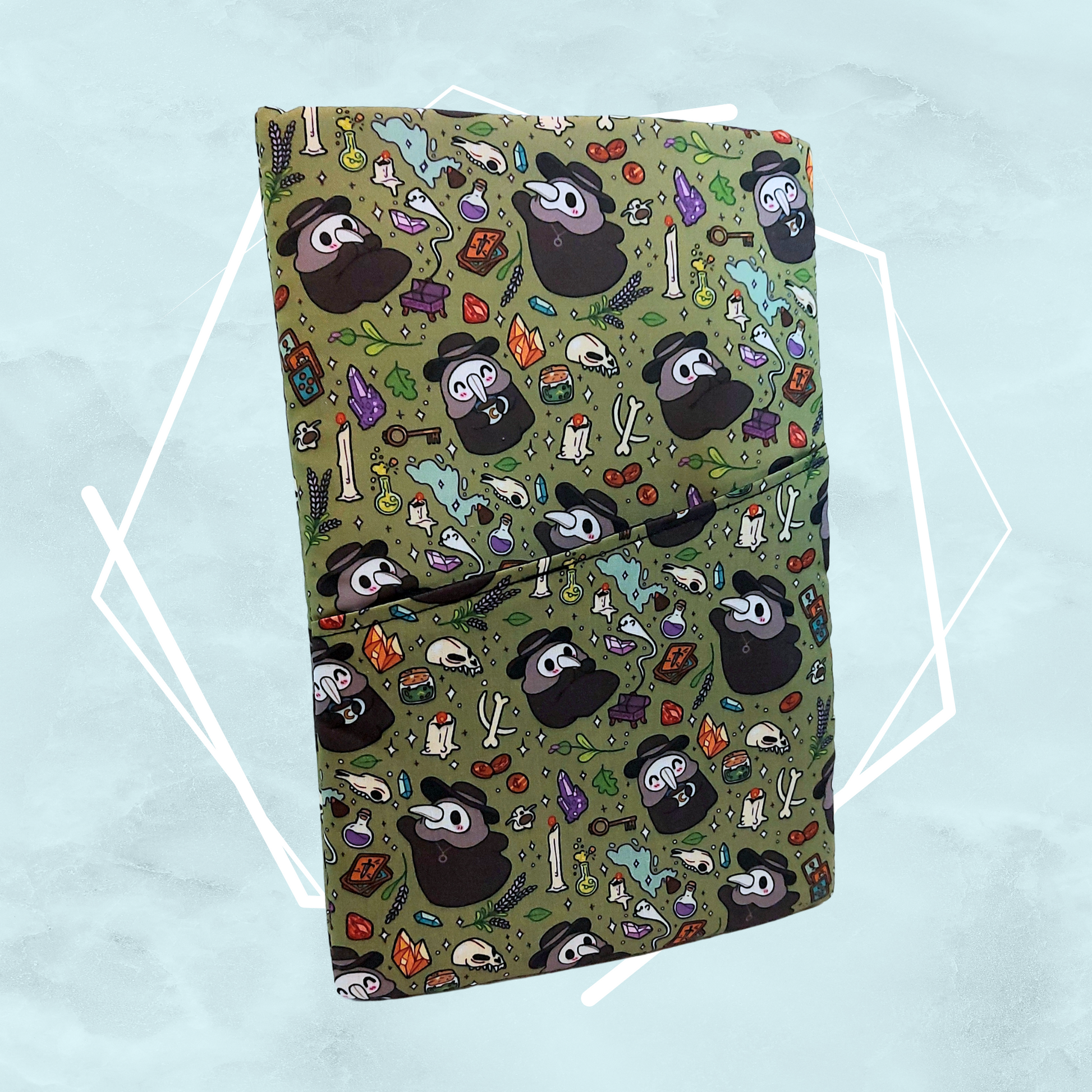 Olive green witchy kawaii horror patterned handmade booksleeve specifically for book lovers, crafted in the UK