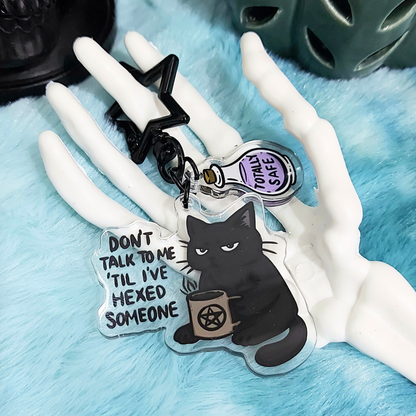 Acrylic charm with black cat holding a mug and funny text, witchy potion and black clasp