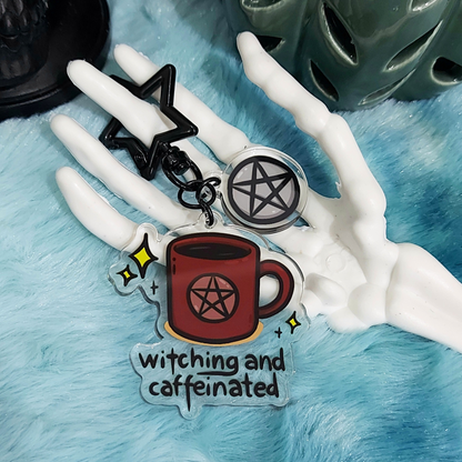 Acrylic keychain with a magical coffee cup design and pentacle symbol with black star shaped clasp