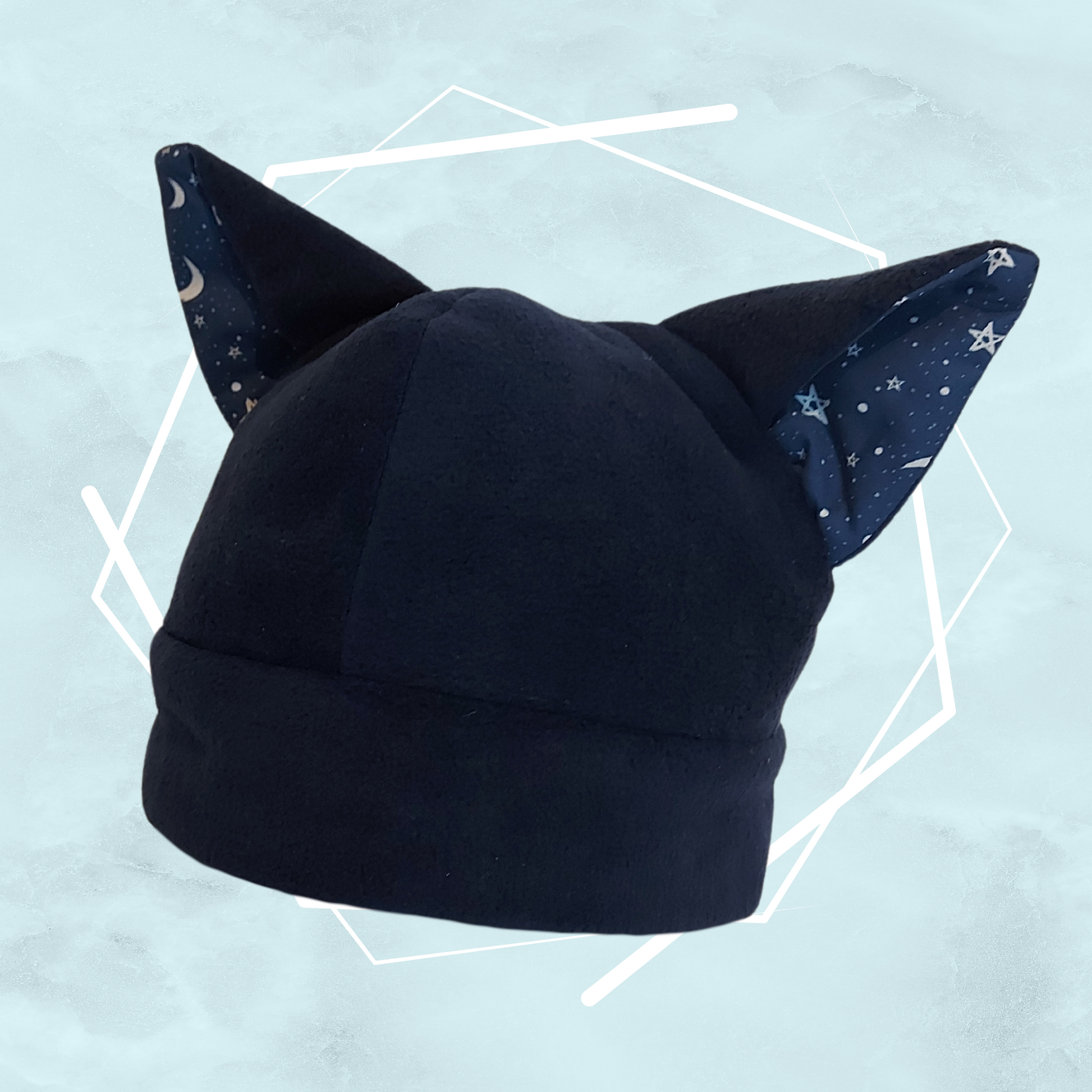 Dark navy blue colored nekomimi beanie hat with star patterned fabric on the cat ears, handmade by Freya's Madpeak